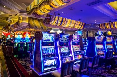 Casino Hold'em game interface on mobile showing dealer cards and community cards